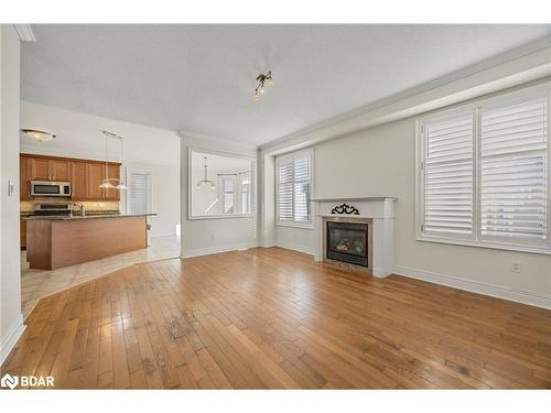 33 Collier Crescent, Angus, ON - Indoor Photo Showing Other Room With Fireplace