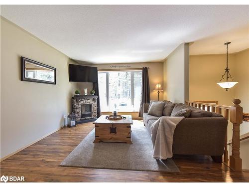 3015 South Sparrow Lake Road, Washago, ON - Indoor Photo Showing Living Room With Fireplace