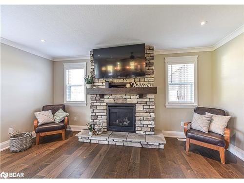 2448 Stockdale Road, Severn, ON - Indoor Photo Showing Living Room With Fireplace