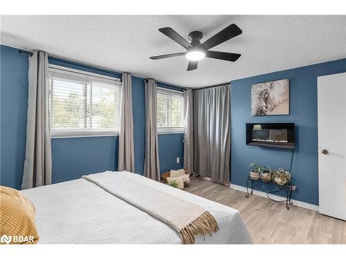 39 Corbett Drive, Barrie, ON - Indoor Photo Showing Bedroom With Fireplace