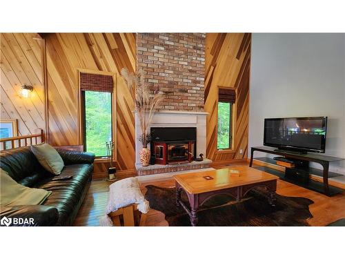 4372 Conners Bay Lane, Coldwater, ON - Indoor Photo Showing Living Room With Fireplace