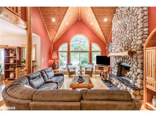 697 Lafontaine Road E, Tiny, ON - Indoor Photo Showing Living Room With Fireplace