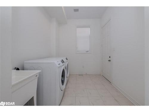 23 Mcisaac Drive, Springwater, ON - Indoor Photo Showing Laundry Room