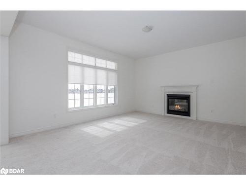 23 Mcisaac Drive, Springwater, ON - Indoor Photo Showing Living Room With Fireplace