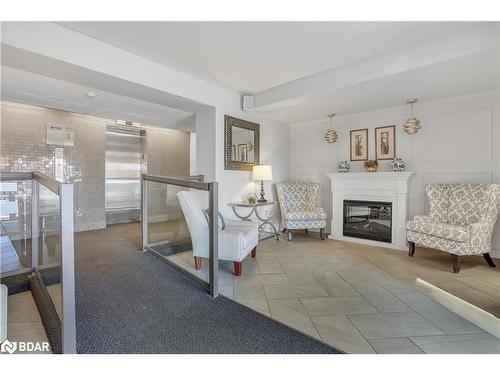 104-414 Blake Street, Barrie, ON - Indoor Photo Showing Living Room With Fireplace