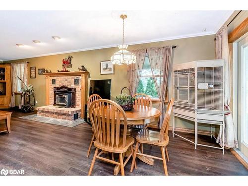 301 Concession 4 East Road, Tiny, ON - Indoor Photo Showing Dining Room With Fireplace