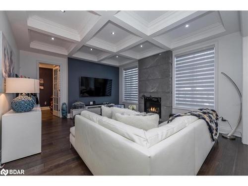 1 Curtis Way, Springwater, ON - Indoor Photo Showing Living Room With Fireplace