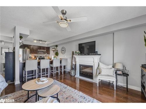 25-137 Sydenham Wells, Barrie, ON - Indoor Photo Showing Living Room With Fireplace