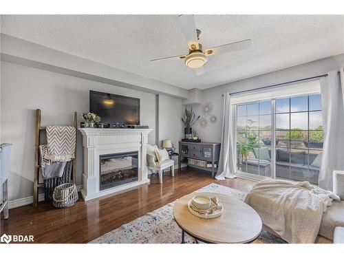 25-137 Sydenham Wells, Barrie, ON - Indoor Photo Showing Living Room With Fireplace