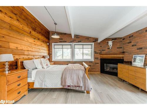 12 Birch Grove Drive, Horseshoe Valley, ON - Indoor Photo Showing Bedroom With Fireplace