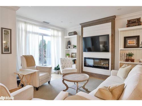 105-90 Orchard Point Road Road, Orillia, ON - Indoor Photo Showing Living Room With Fireplace