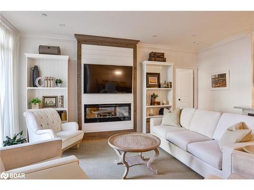 105-90 Orchard Point Road Road, Orillia, ON - Indoor Photo Showing Living Room With Fireplace