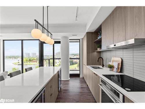 523-185 Dunlop Street E, Barrie, ON - Indoor Photo Showing Kitchen With Double Sink