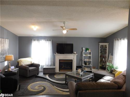 9 Trellis Lane, Innisfil, ON - Indoor Photo Showing Living Room With Fireplace