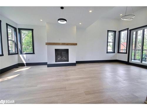 4356 Hepinstall Landing, Washago, ON - Indoor Photo Showing Living Room With Fireplace