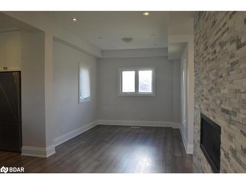 3 Beverly Street, Elmvale, ON - Indoor Photo Showing Other Room With Fireplace