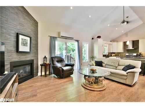 16 Macedonia Circle, Tiny, ON - Indoor Photo Showing Living Room With Fireplace