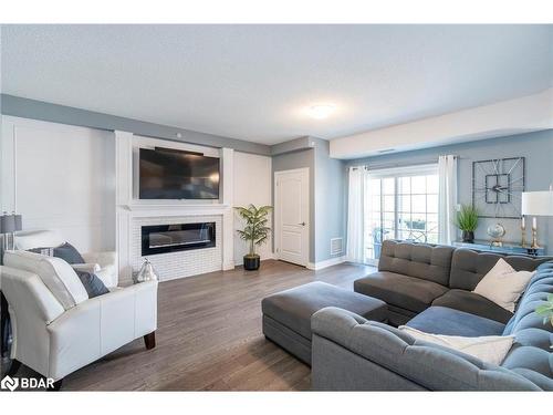 401-44 Ferndale Drive S, Barrie, ON - Indoor Photo Showing Living Room With Fireplace