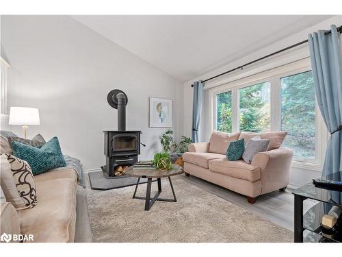 1560 Wilson Drive, Springwater, ON - Indoor Photo Showing Living Room With Fireplace