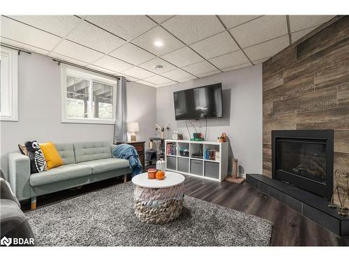 1560 Wilson Drive, Springwater, ON - Indoor Photo Showing Living Room With Fireplace