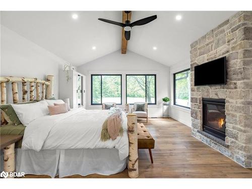 2764 Fairgrounds Road, Severn, ON - Indoor Photo Showing Bedroom With Fireplace