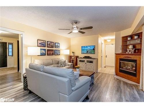 1166 Sunnidale Road, Springwater, ON - Indoor Photo Showing Living Room With Fireplace