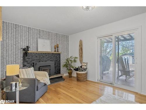 20 Jamieson Drive, Rosemont, ON - Indoor Photo Showing Living Room With Fireplace