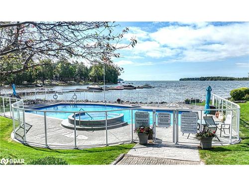 206-585 Atherley Road, Orillia, ON - Outdoor With Body Of Water With In Ground Pool With View