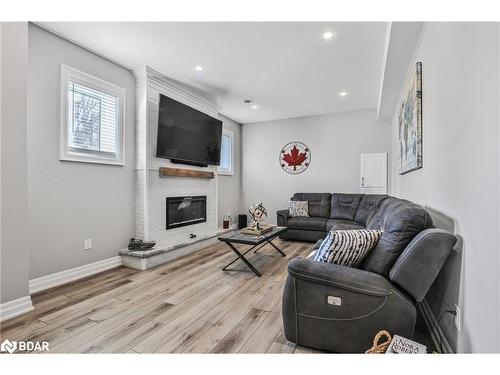 61 Collier Crescent, Angus, ON - Indoor Photo Showing Living Room With Fireplace