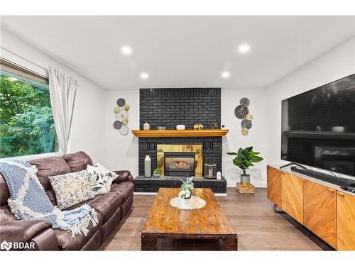 35 Pooles Road, Springwater, ON - Indoor Photo Showing Living Room With Fireplace