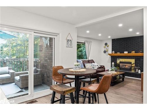 35 Pooles Road, Springwater, ON - Indoor Photo Showing Dining Room With Fireplace