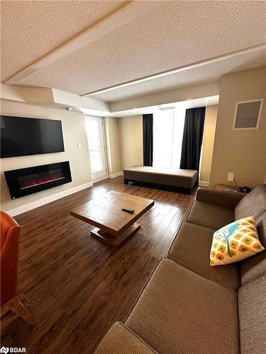 3112/3114-9 Harbour Street E, Collingwood, ON - Indoor Photo Showing Living Room With Fireplace