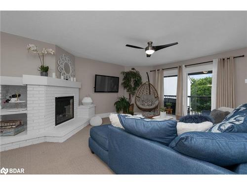 303-1102 Horseshoe Valley Road W, Horseshoe Valley, ON - Indoor Photo Showing Living Room With Fireplace