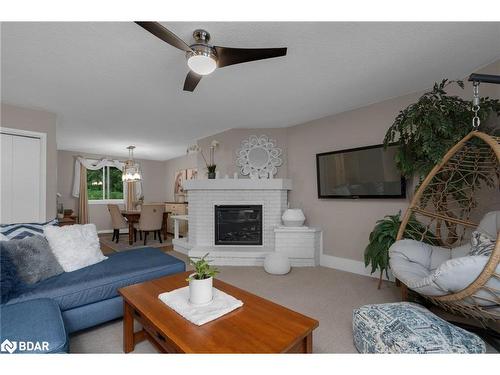 303-1102 Horseshoe Valley Road W, Horseshoe Valley, ON - Indoor Photo Showing Living Room With Fireplace