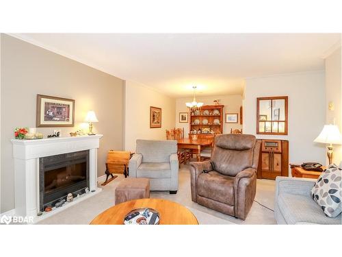 305-131 Clapperton Street, Barrie, ON - Indoor Photo Showing Living Room With Fireplace