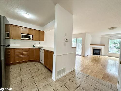 509 Mariner Drive, Waterloo, ON - Indoor Photo Showing Kitchen With Fireplace