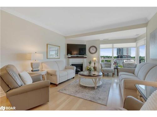 1210-6 Toronto Street, Barrie, ON - Indoor Photo Showing Living Room With Fireplace