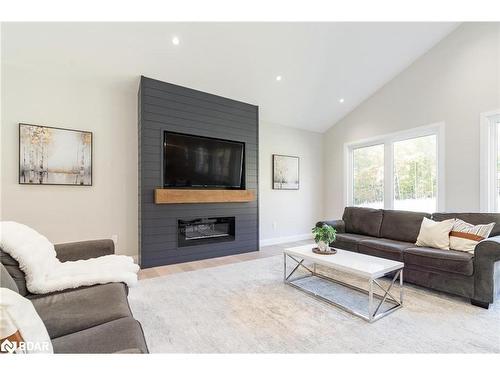 1250 Old Parry Sound Road, Utterson, ON - Indoor Photo Showing Living Room With Fireplace