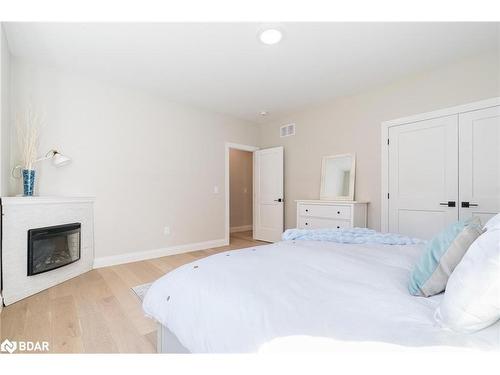 1250 Old Parry Sound Road, Utterson, ON - Indoor Photo Showing Bedroom With Fireplace