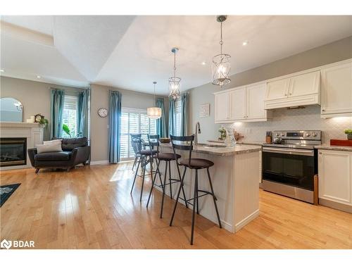 107 Cumming Drive, Barrie, ON - Indoor Photo Showing Kitchen With Fireplace With Upgraded Kitchen