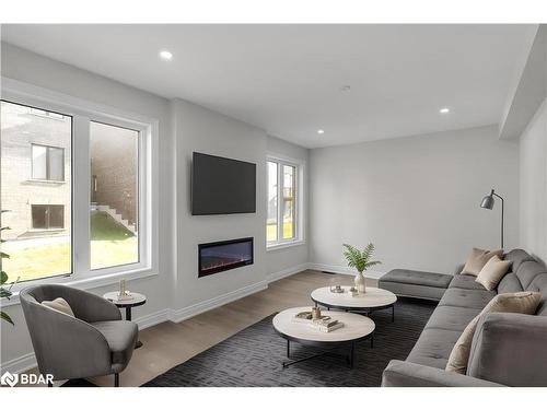 109 Bearberry Road, Springwater, ON - Indoor Photo Showing Living Room With Fireplace