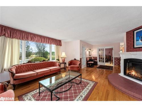 1705 Concession 8-9 Road E, Beaverton, ON - Indoor Photo Showing Living Room With Fireplace