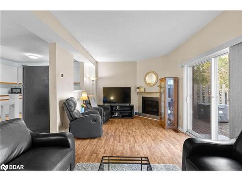 4-304 Thomas Street, Stayner, ON - Indoor Photo Showing Living Room With Fireplace