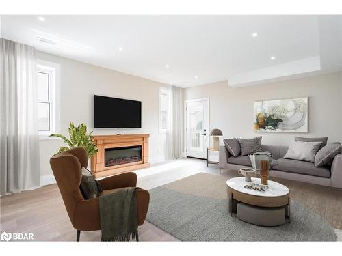 9 Bertram Drive, Elmvale, ON - Indoor Photo Showing Living Room With Fireplace