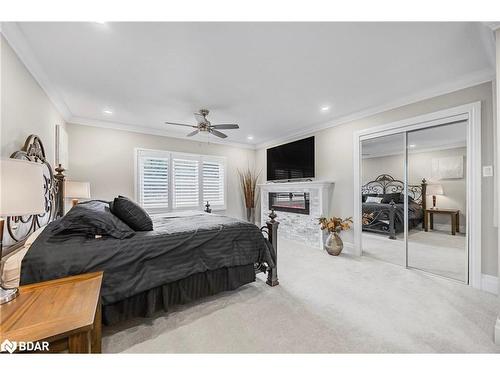 7 Howard Crescent, Barrie, ON - Indoor Photo Showing Bedroom With Fireplace