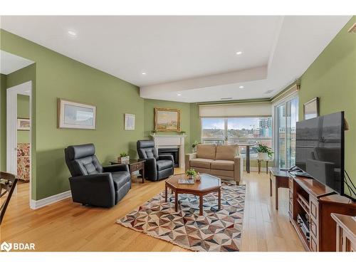 609-6 Toronto Street, Barrie, ON - Indoor Photo Showing Living Room With Fireplace