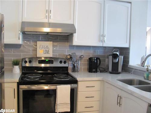 605-150 Dunlop Street E, Barrie, ON - Indoor Photo Showing Kitchen With Double Sink