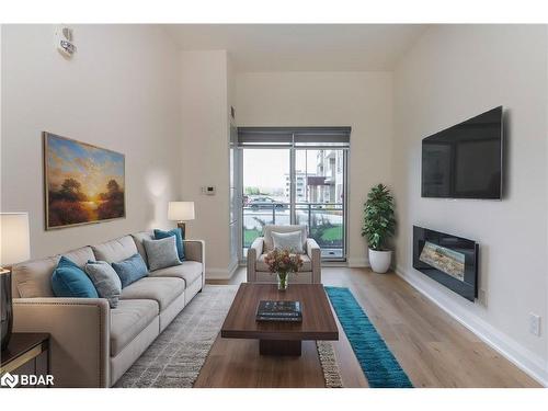 101-58 Lakeside Terrace, Barrie, ON - Indoor Photo Showing Living Room With Fireplace