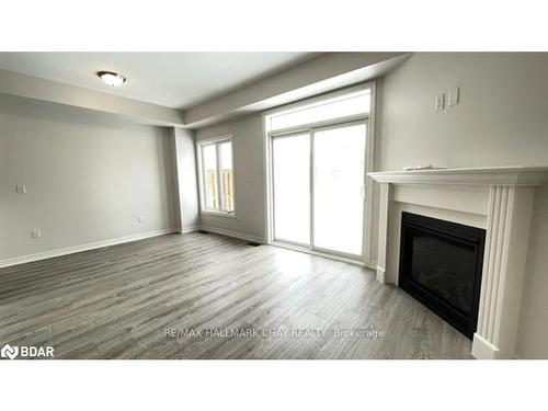 7 Churchlea Mews, Orillia, ON - Indoor Photo Showing Living Room With Fireplace