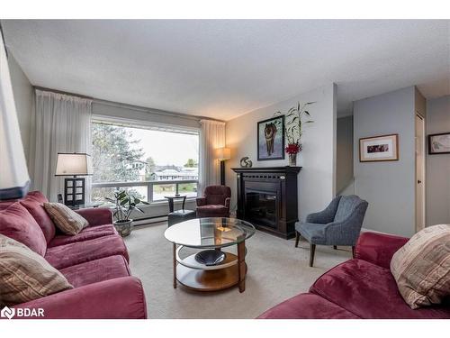 23 Brennan Avenue, Barrie, ON - Indoor Photo Showing Living Room With Fireplace